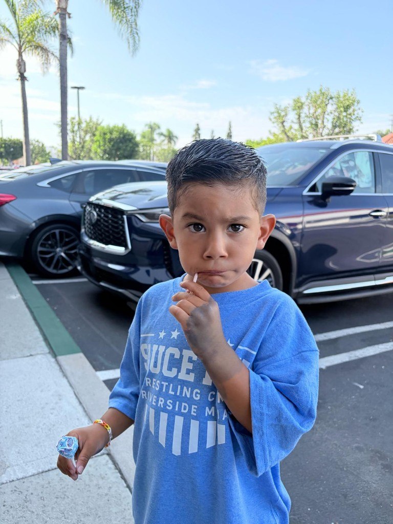 Young wrestler in Sauce Wrestling Club shirt